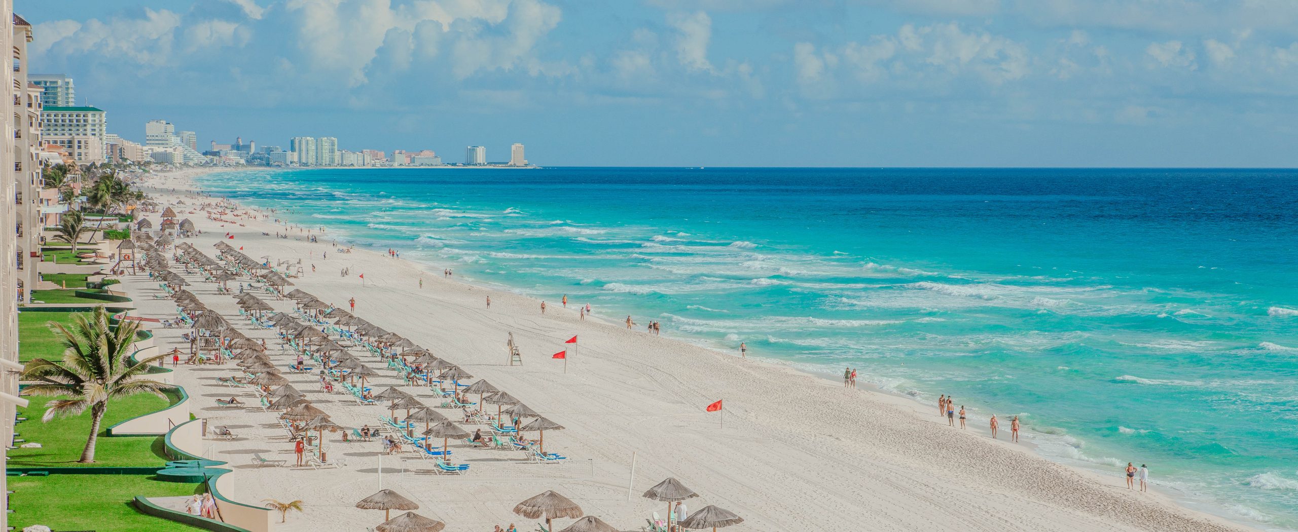 A view along the beach of the Caribbean Sea and hotels in Cancun, Mexico